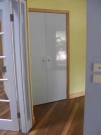 Doors and frame treated with Vindo #629 natural oil paint, white gloss. Walls with Sunny Yellow #410.