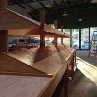 Ply shelving stands treated with the Kunos white at an organic grocer